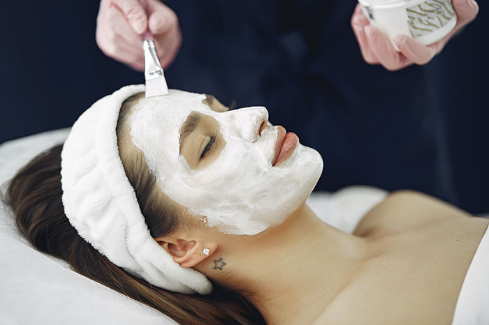 women with white mask