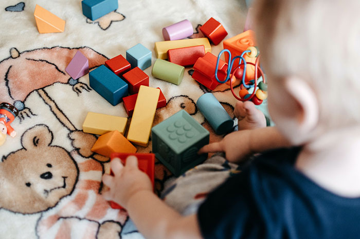 baby playing with blocks