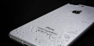 wet iPhone 7 on balck surface