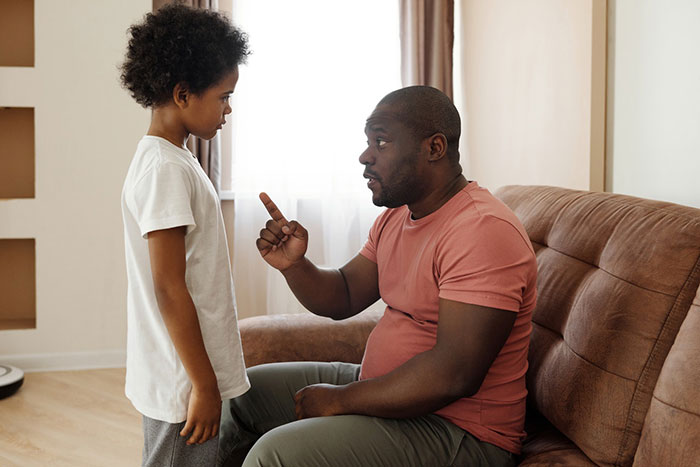 a boy listening to his father