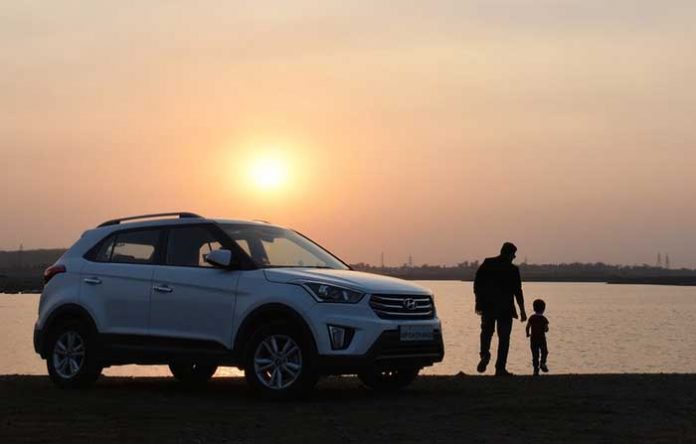 Sunset and family car