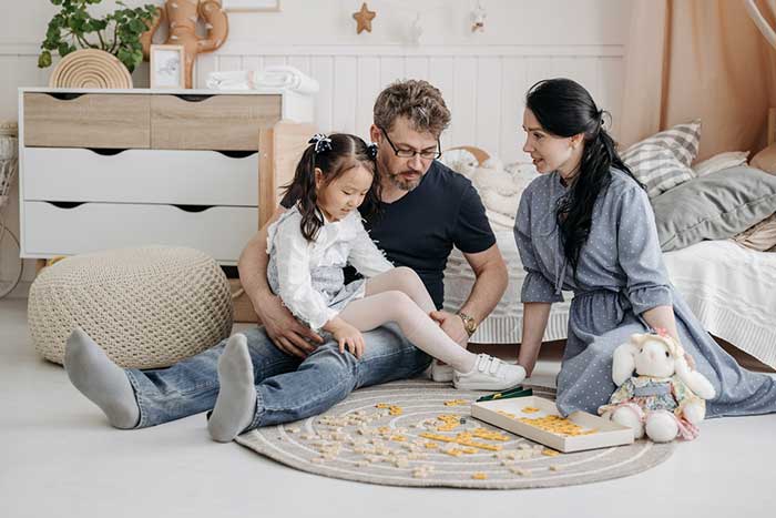 Parents playing with their child